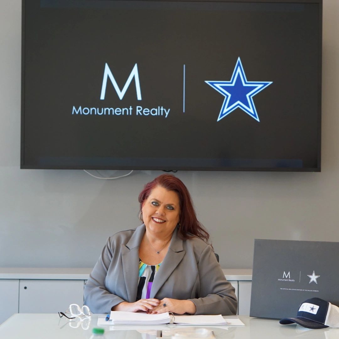 Heather McIlroy at Monument Realty office
